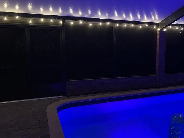 Lighting around pool house and color changing LED lights in the pool