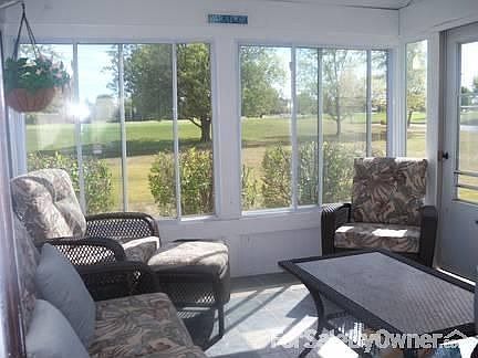 Sunroom with tile floor on 1st tee