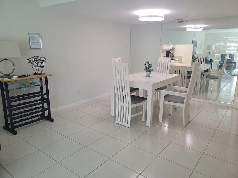Dining table has a leaf to expand. 8 dining chairs available.