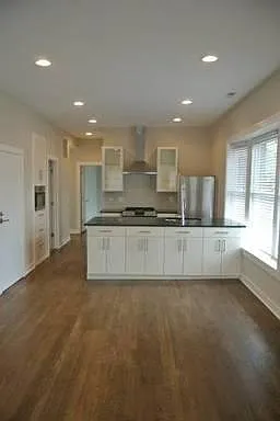 Oak flooring. Island storage cabinets and drawers.