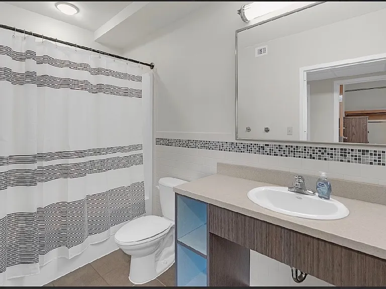 Spacious bathrooms with large mirrors for your convenience