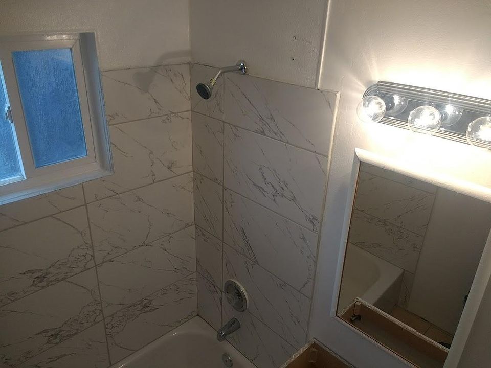 Complete bathroom remodel w/ new tub, porcelain tile surroun