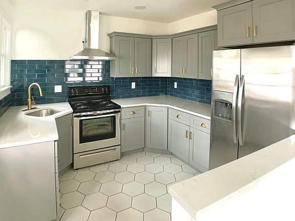 Updated kitchen with stainless appliances, lots of cabinets and ample counter space.