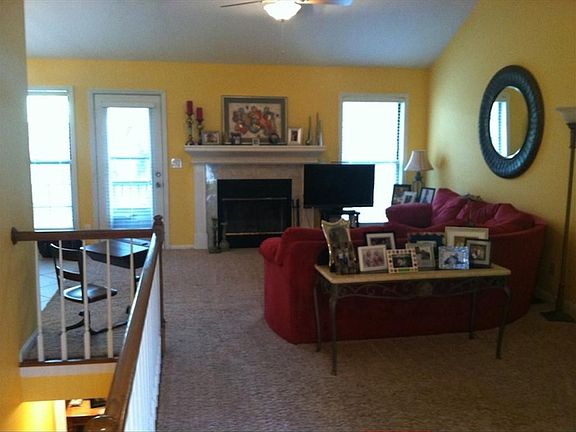 Living room with wood burning fireplace
