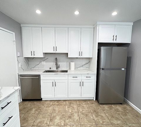 Kitchen with New cabinets, Quartz Counter Tops and New Appliance