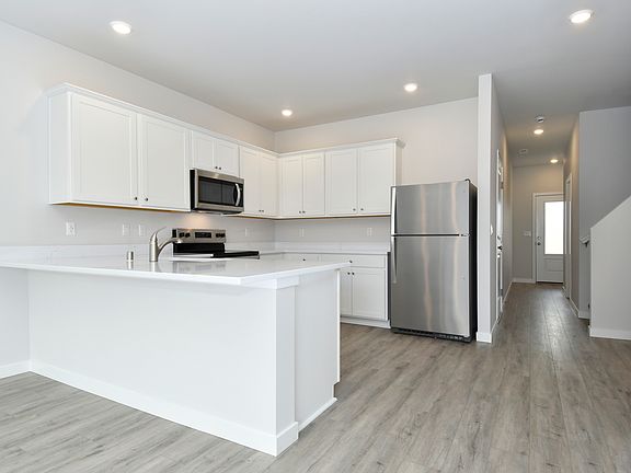This floor plan seamlessly flows between the kitchen and living spaces.
