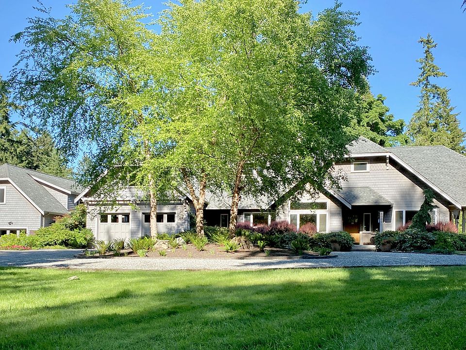 1.2+ acres: Manicured lawns, colorful gardens