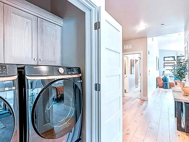 In-unit laundry with full-size Samsung front-loading washer and dryer _ conveniently located off the main hallway