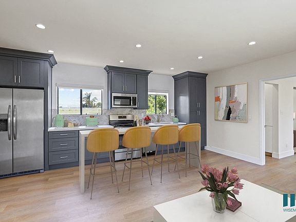 Open-Concept Kitchen Energy-Efficient Appliances and with Countertop Island Bar