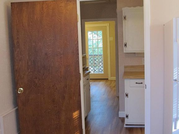 Kitchen nook looking out to the front. Walk in pantry is just past the kitchen.