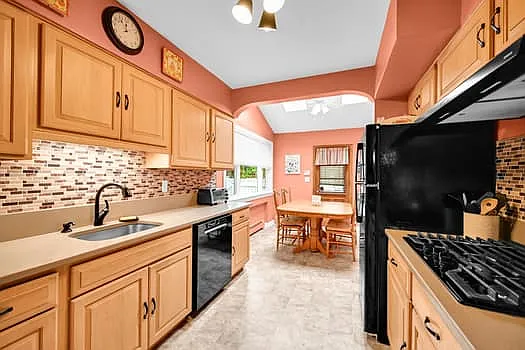 Updated Kitchen w/separate dining area w/skylight & door to mud room