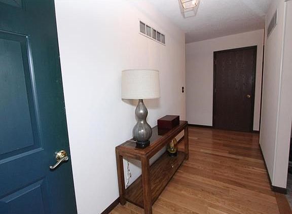Large entry foyer with a lot of open space, entrance to what is currently being used as an office, but could be used in a variety of ways.