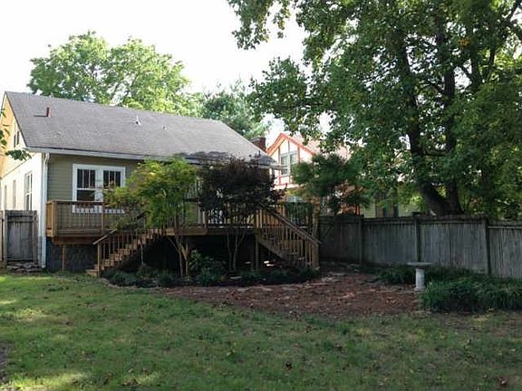 Back of house and fenced-in yard