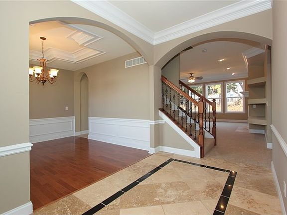 Large Formal Entry With Travertine Floor & Black Granite Ribbon
