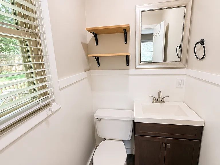 Primary Bedroom attached half bathroom