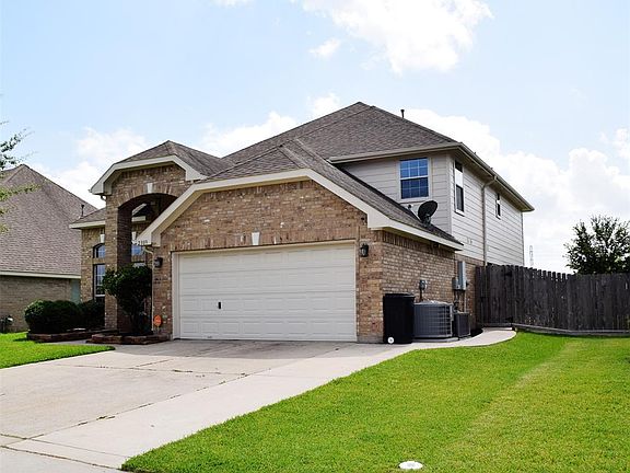 Front right of house showing extended drive and sidewalk to backyard.