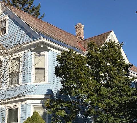 The Blue House on Glenwood, a Victorian duplex in a well established neighborhood
