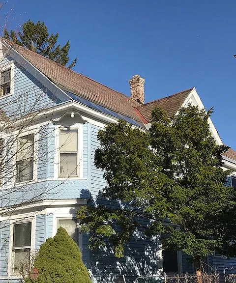 The Blue House on Glenwood, a Victorian duplex in a well established neighborhood