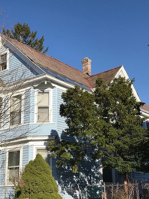 The Blue House on Glenwood, a Victorian duplex in a well established neighborhood