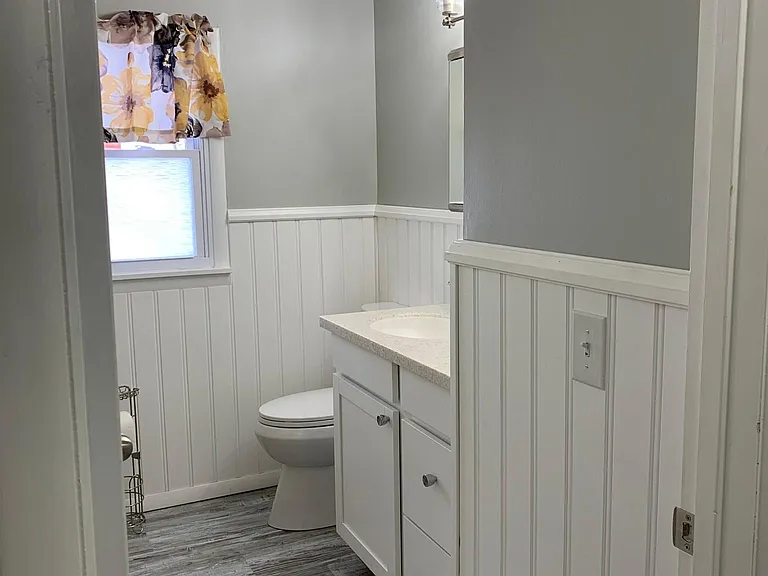 Second floor remodeled bathroom with oversized vanity & mirrored medicine cabinet