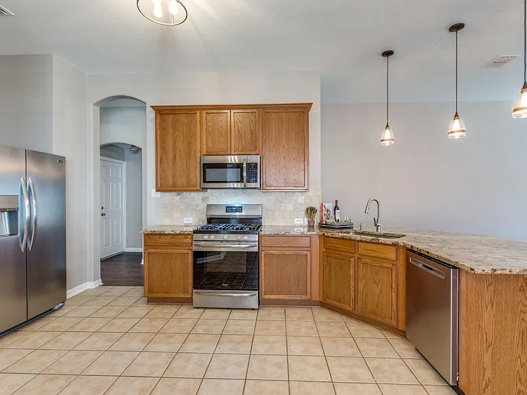 The kitchen really is the center of the home. The oversized bar allows at least four additional barstools offering lots offering room for additional guest.