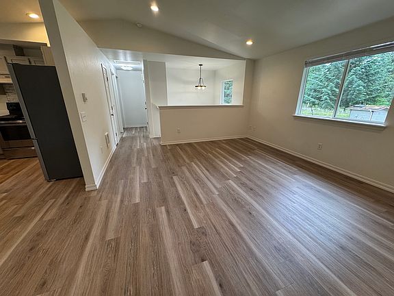 Spacious living room with vaulted ceilings. Very open and bright.