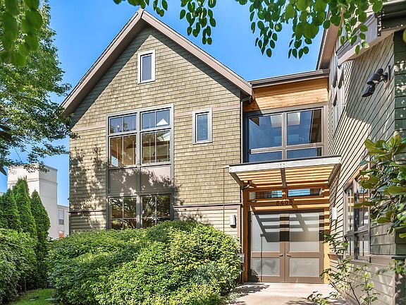 Discreetly tucked behind lush landscaping...as you enter the curved front walkway and round the corner, this handsome home is revealed. Classic, bones that will stand the test of time.