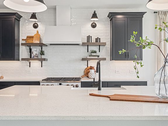 Kitchen with stylish floating shelves