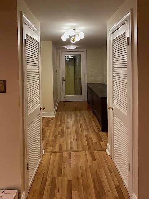 Entrance Hall. Storage in historic coal bins and two hall closets.