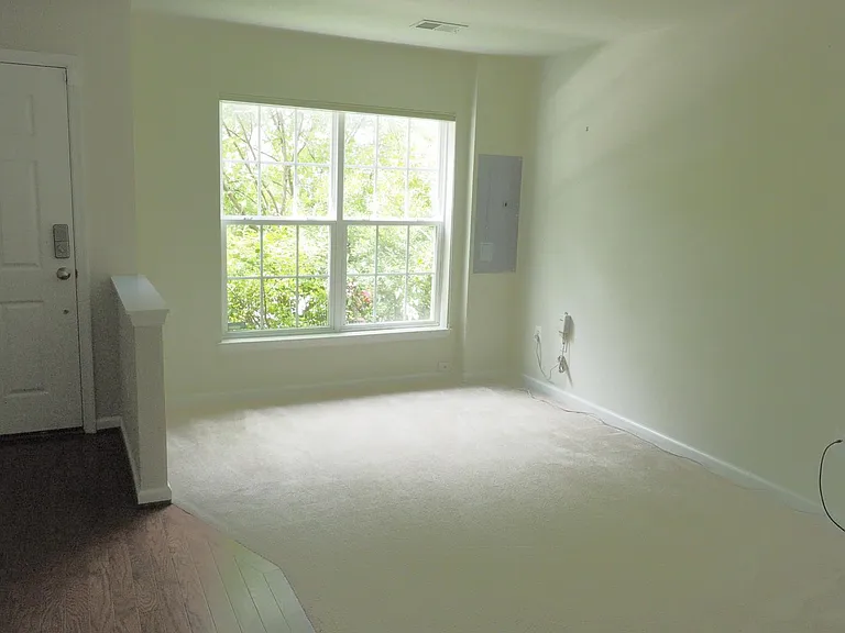 Den at front of house on ground floor.