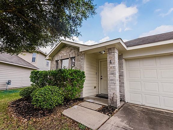 Covered front entry and 2 car garage.