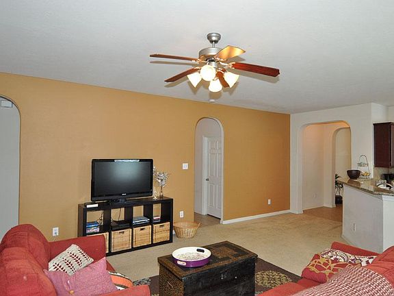 View fantastic living room/den from back door: grand arches & large arch niche welcome your guests f
