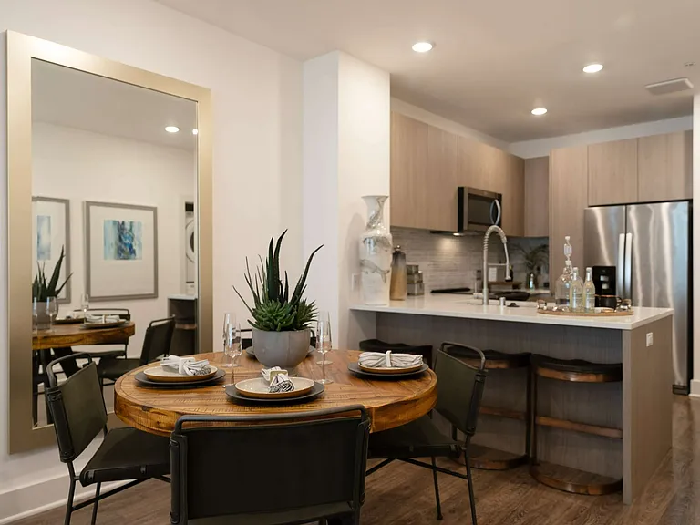 Gather, dine, and entertain effortlessly in this warm, modern space with sleek finishes and an inviting layout.