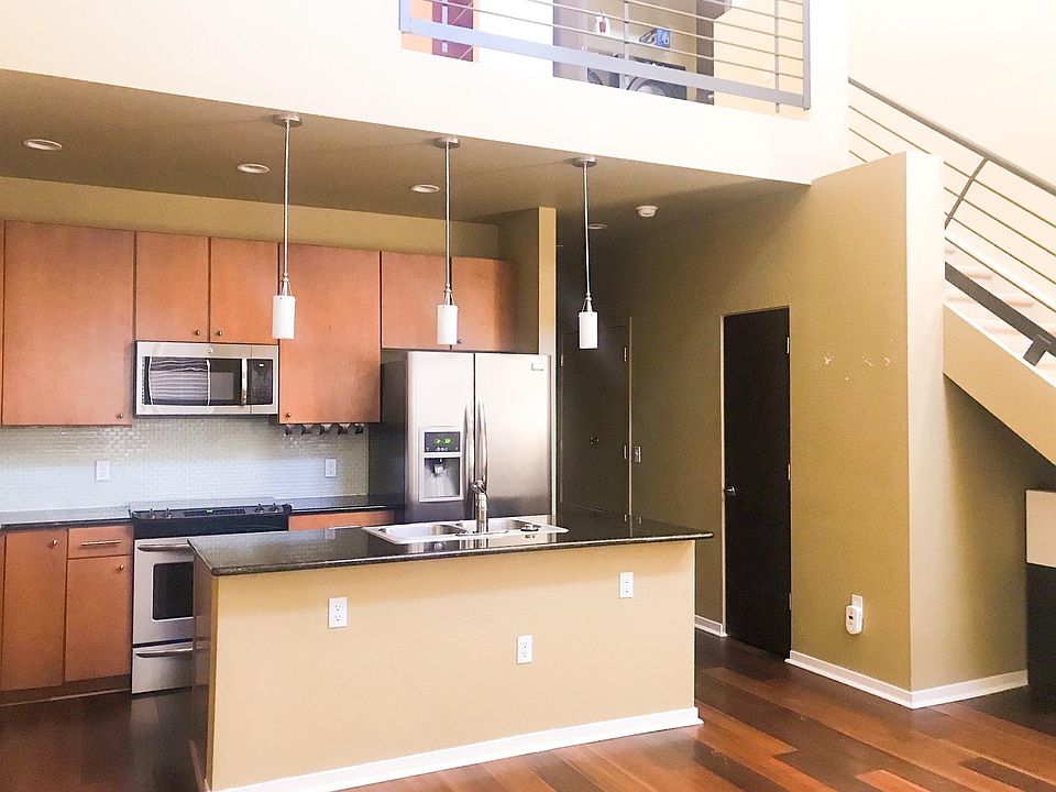 Beautiful modern open floor plan kitchen. Large center island with granite countertops.