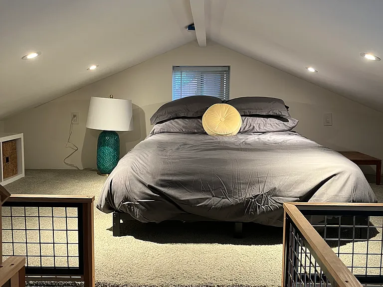 double size bed on a modified frame-low ceiling (5 ft at highest point)