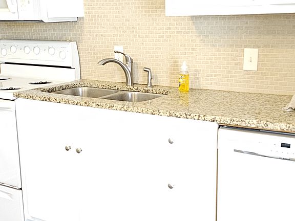Granite counters, los of cabinets,
 stove,dishwasher,microwave and refrigerator with icemaker.