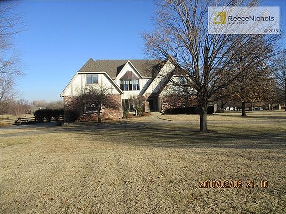 Spacious 1 1/2 story with large rooms.  There is a 3 car side entry garage a with a 4th car detached garage.