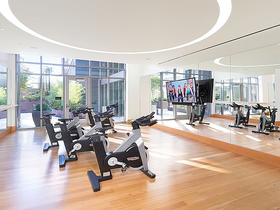 Expansive fitness center featuring a spin room