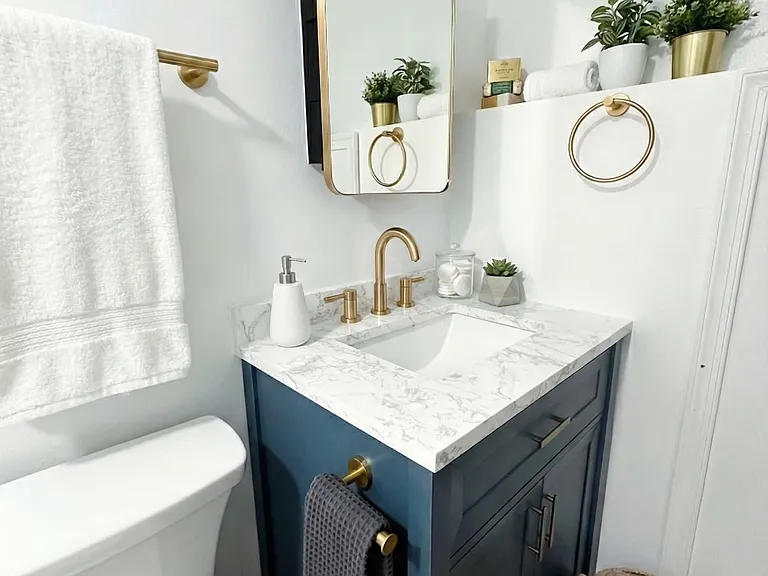 Detail view of bathroom shelving and decor with clean, polished styling.