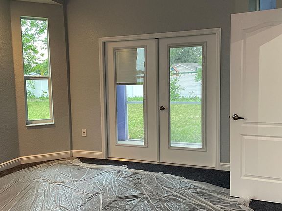 Main bedroom with patio access
