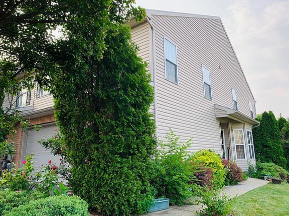 A gorgeous end unit with beautiful flowers and plants