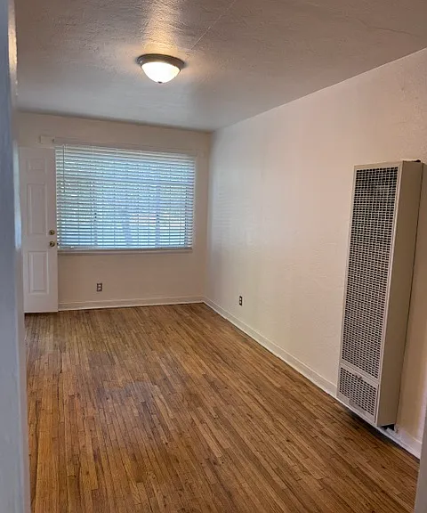 Well lit living room facing entrance