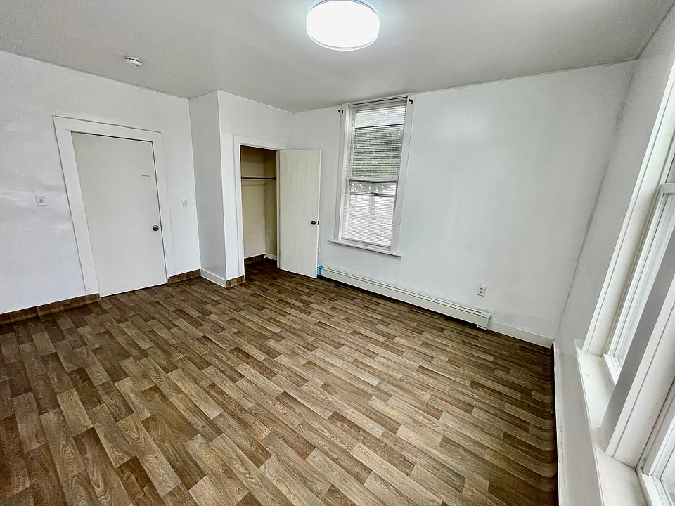 A bedroom next to the living room