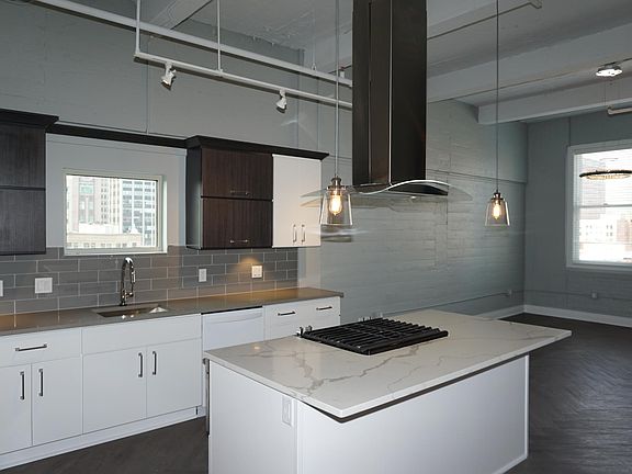 Kitchen island with gas range & hood