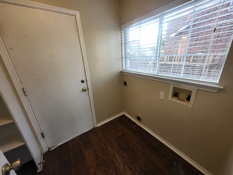 Laundry room with lots of shelving in the pantry area