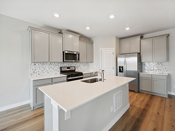 The kitchen of the Pike has beautiful quartz countertops.