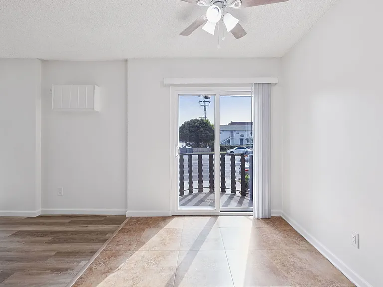 Airy dining area with living room on the left