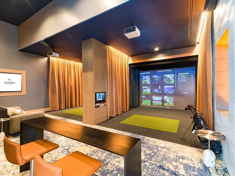 An immersive golf simulator at Modera McGavock, offering a refined way to practice your swing just minutes from Nashville's music and dining scene.
