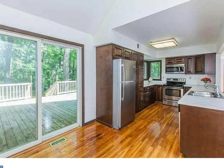 Side entrance to the house on the left accesses the kitchen