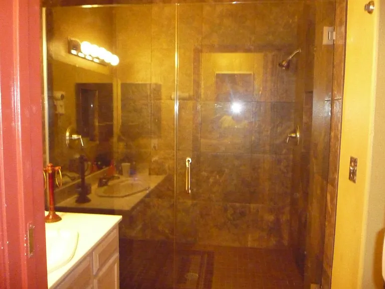 BATHROOM W/ "HIS & HERS" SHOWERS